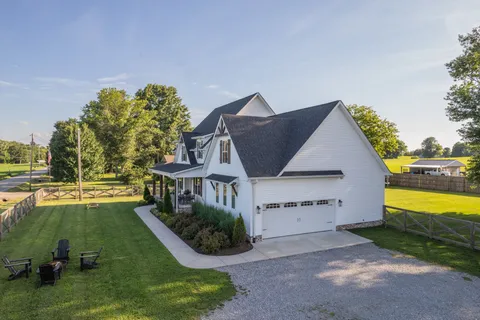 an aerial view of a house with a garden and plants