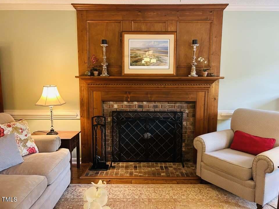 2908 Bolo Trail Raleigh, NC 27615 - Photo 7 of 41 a living room with furniture and a fireplace
