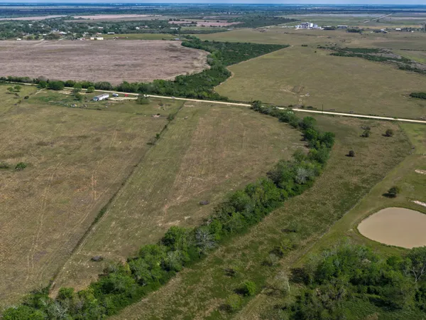 an aerial view of a houses with outdoor space