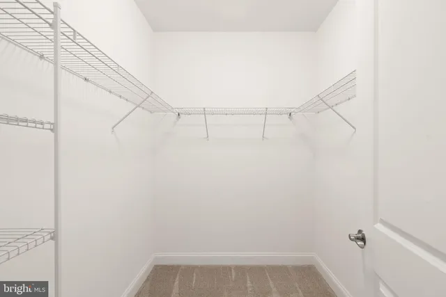 a view of small space with racks on the wall