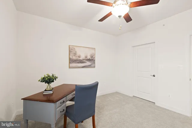 a workspace with furniture and window