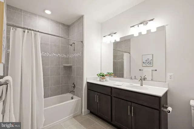 a bathroom with a tub a sink double and a mirror