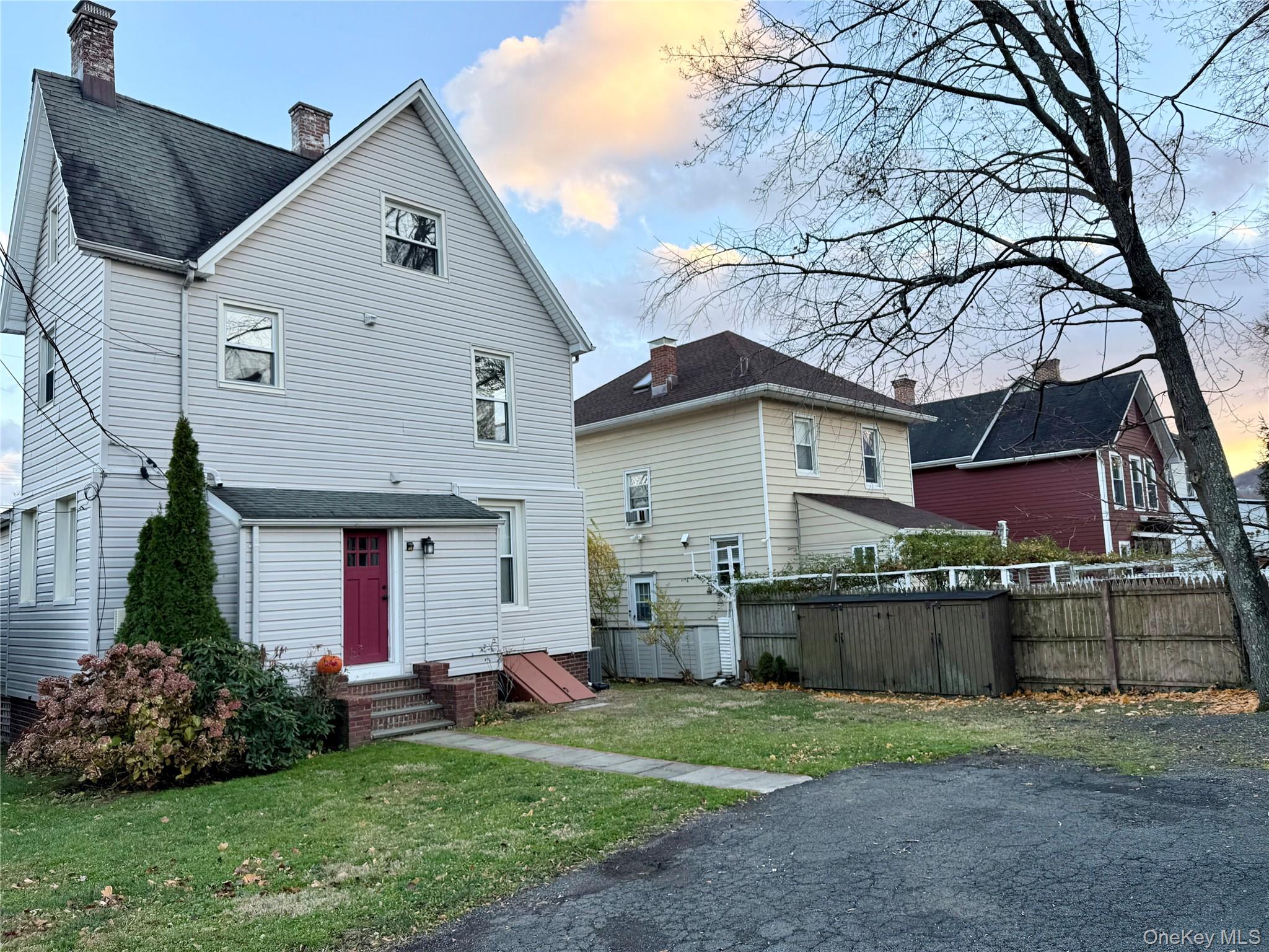 102 North Midland Avenue, Unit 2 Nyack, NY 10960 - Photo 18 of 19 a front view of a house with a yard and garage