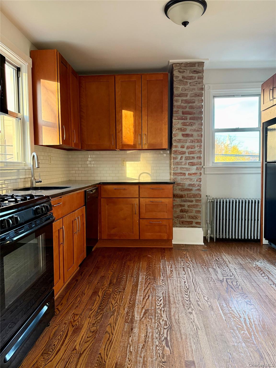 102 North Midland Avenue, Unit 2 Nyack, NY 10960 - Photo 6 of 19 a kitchen with wooden floors and a sink