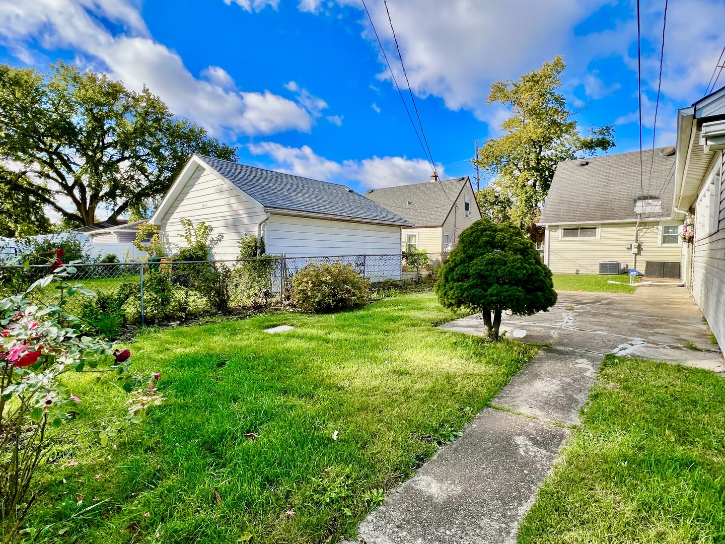3437 Scott Street Franklin Park, IL 60131 - Photo 38 of 44 a view of a garden with a fountain