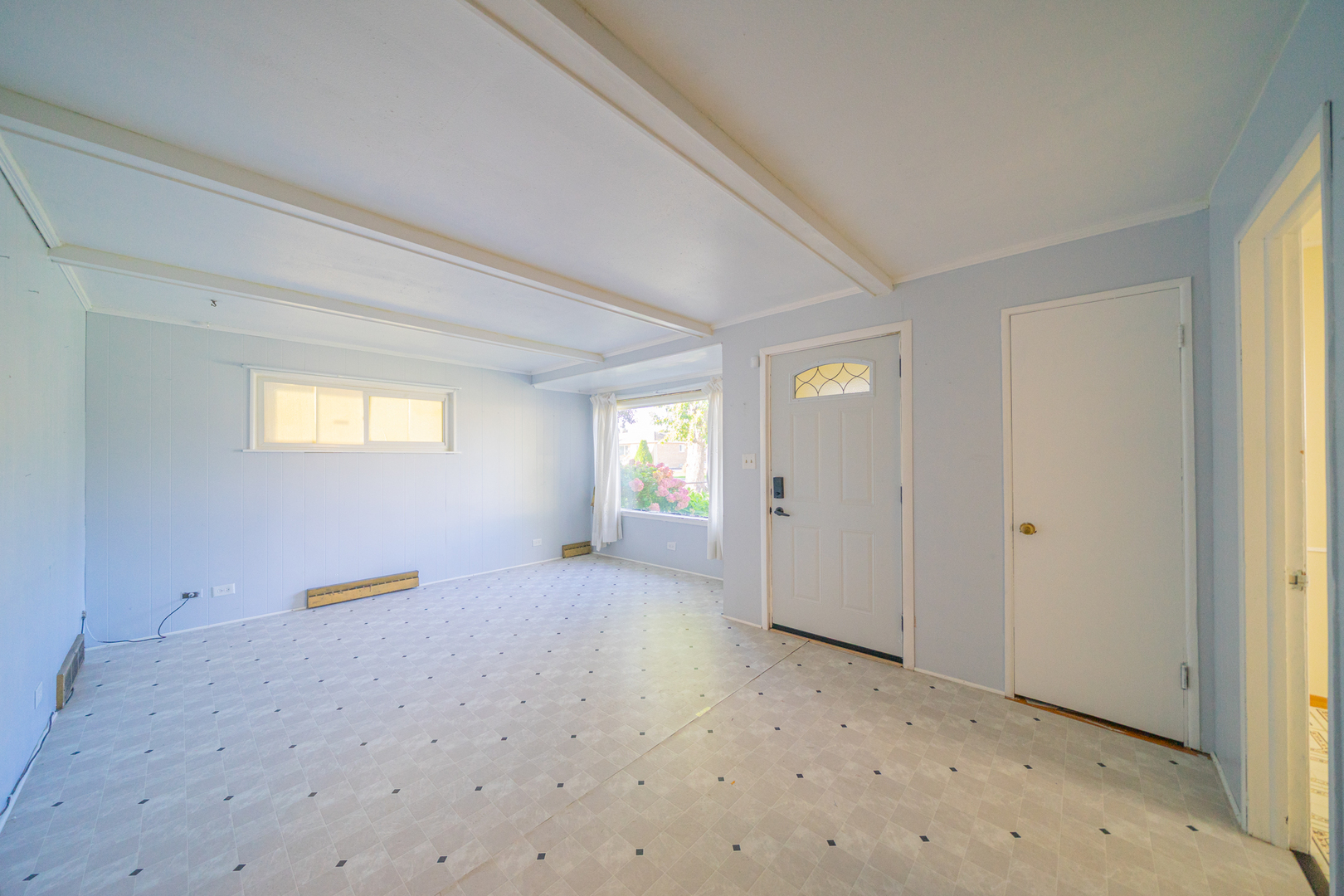 3437 Scott Street Franklin Park, IL 60131 - Photo 4 of 44 a view of an empty room with a window