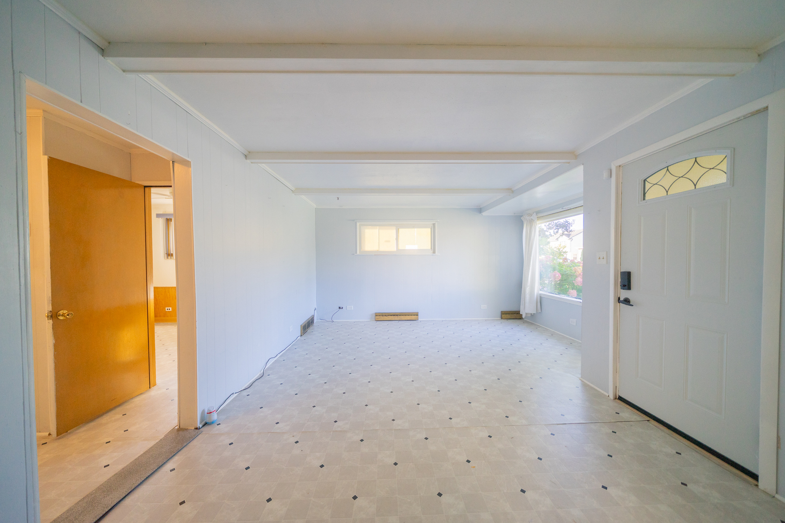 3437 Scott Street Franklin Park, IL 60131 - Photo 5 of 44 a view of a livingroom with wooden floor and windows