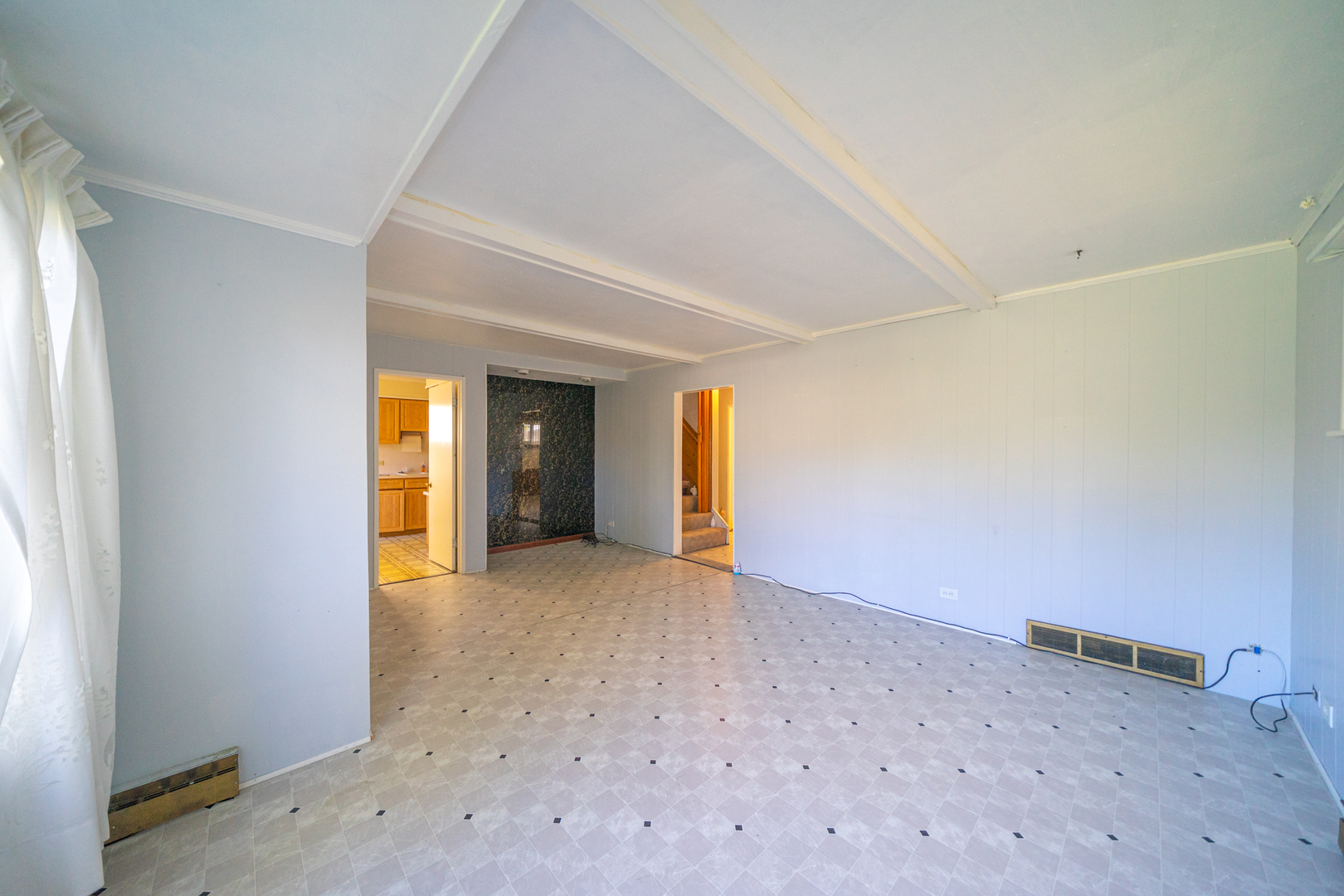 3437 Scott Street Franklin Park, IL 60131 - Photo 7 of 44 an empty room with a natural light