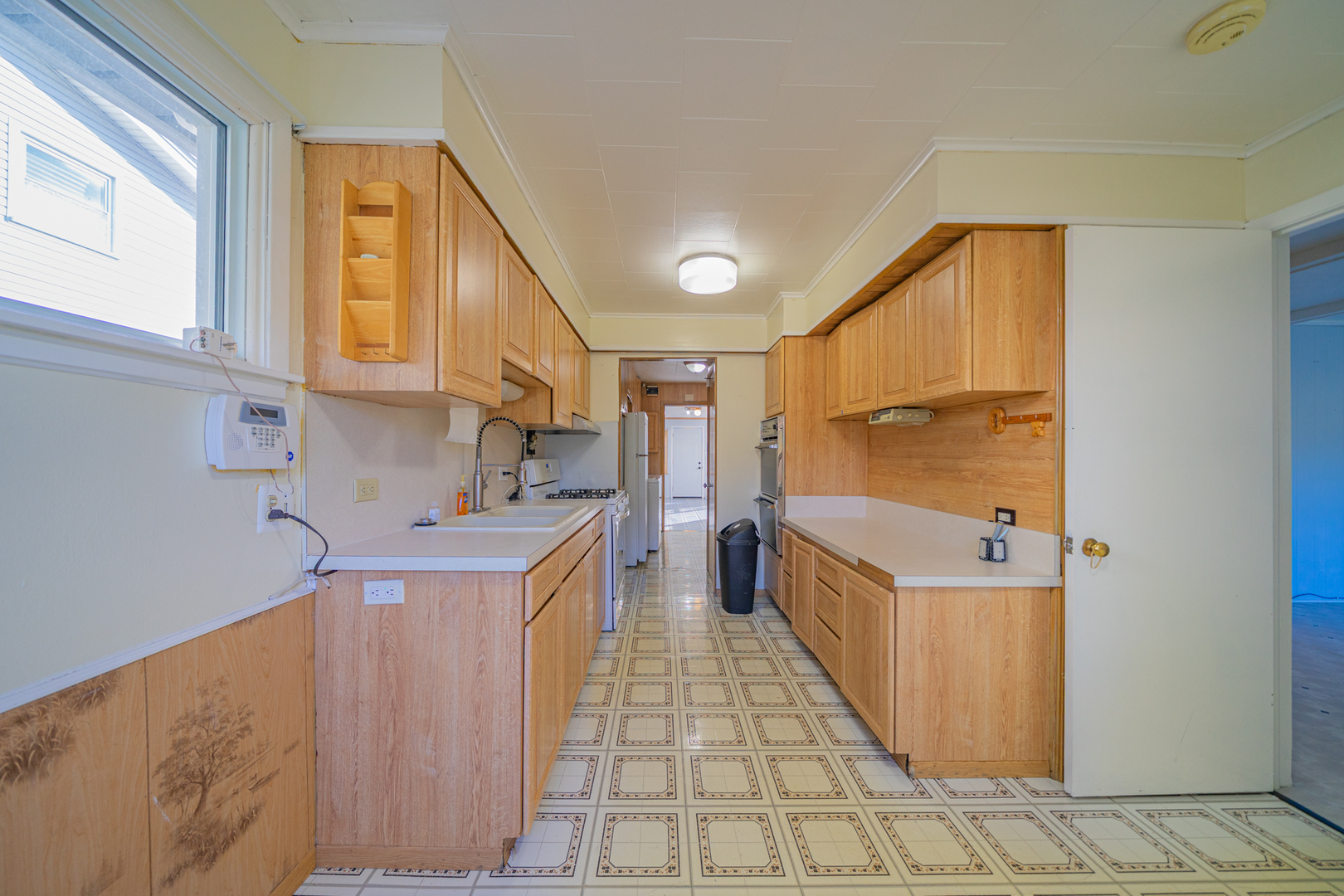 3437 Scott Street Franklin Park, IL 60131 - Photo 8 of 44 a kitchen with stainless steel appliances granite countertop a sink and cabinets