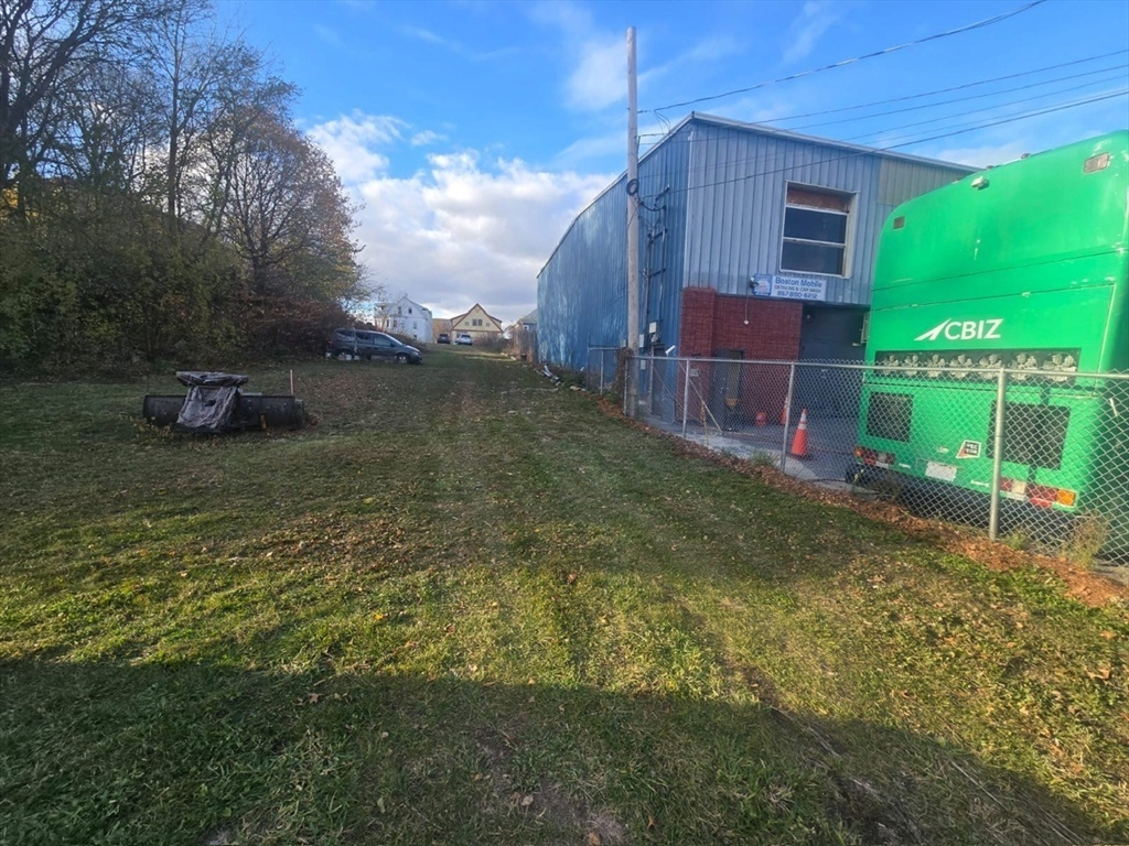 51 Ceylon Street Boston, MA 02121 - Photo 4 of 18 a backyard of a house with lots of green space