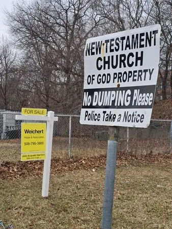 a sign broad on the side of the road