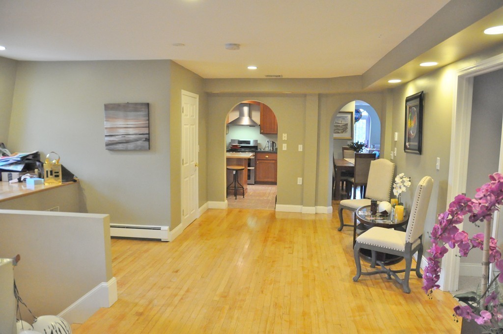 8-10 Bennington Street Newton, MA 02458 - Photo 15 of 22 a bedroom with a bed and wooden floor