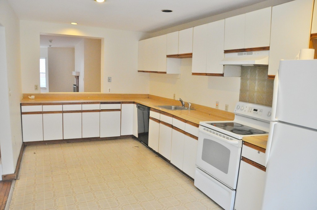8-10 Bennington Street Newton, MA 02458 - Photo 19 of 22 a kitchen that has a sink and a stove