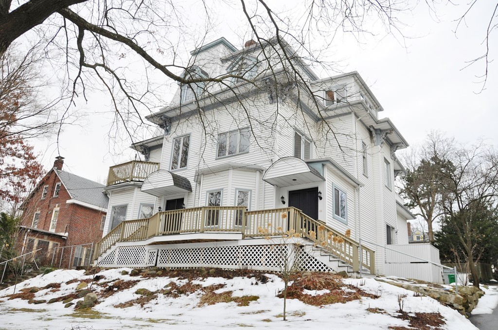 8-10 Bennington Street Newton, MA 02458 - Photo 2 of 22 a view of a building with a snow