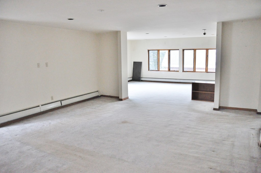 8-10 Bennington Street Newton, MA 02458 - Photo 6 of 22 a view of an empty room with a window