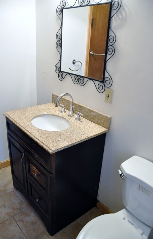8-10 Bennington Street Newton, MA 02458 - Photo 9 of 22 a bathroom with a sink and a toilet