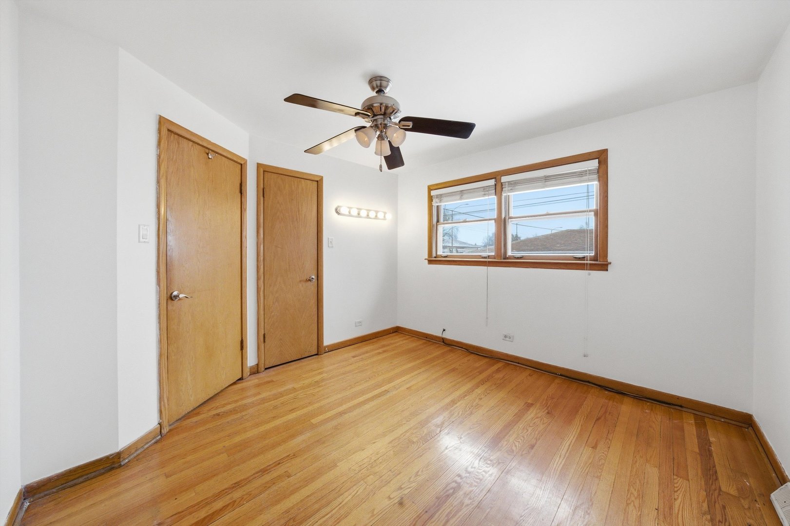 3701 West 80th Street Chicago, IL 60652 - Photo 14 of 34 a view of empty room with wooden floor and ceiling fan
