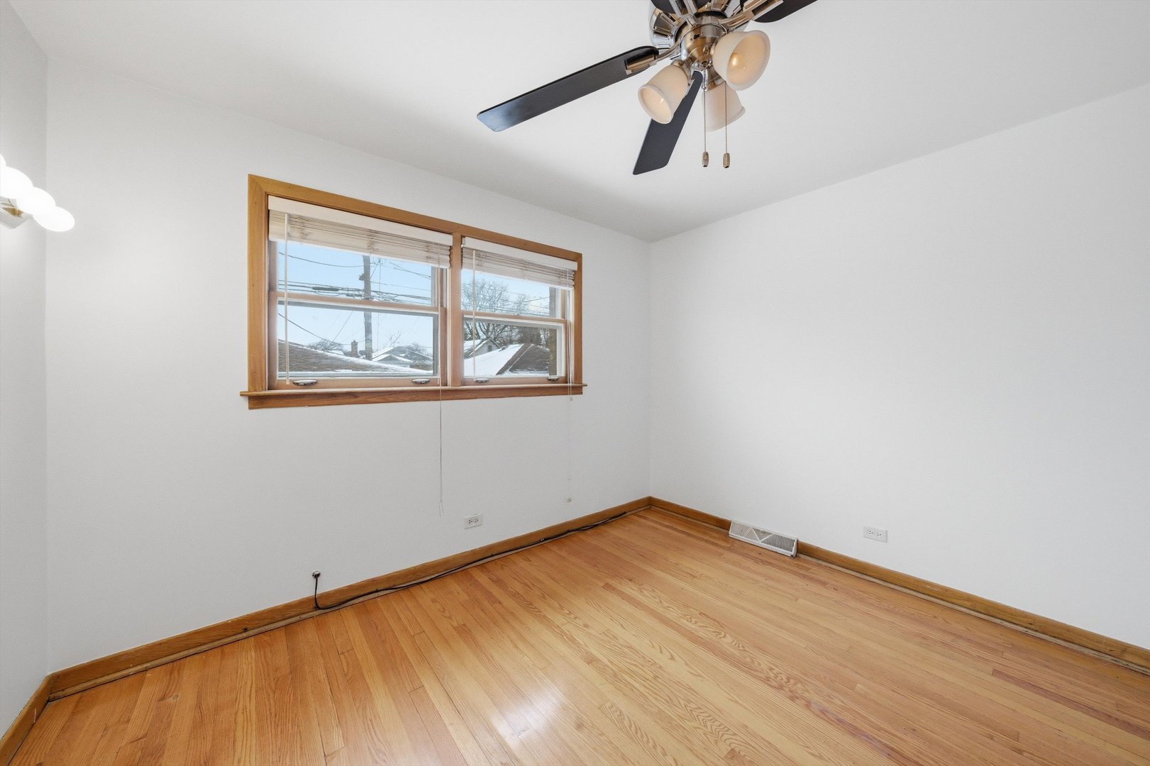 3701 West 80th Street Chicago, IL 60652 - Photo 15 of 34 a view of empty room with wooden floor and fan