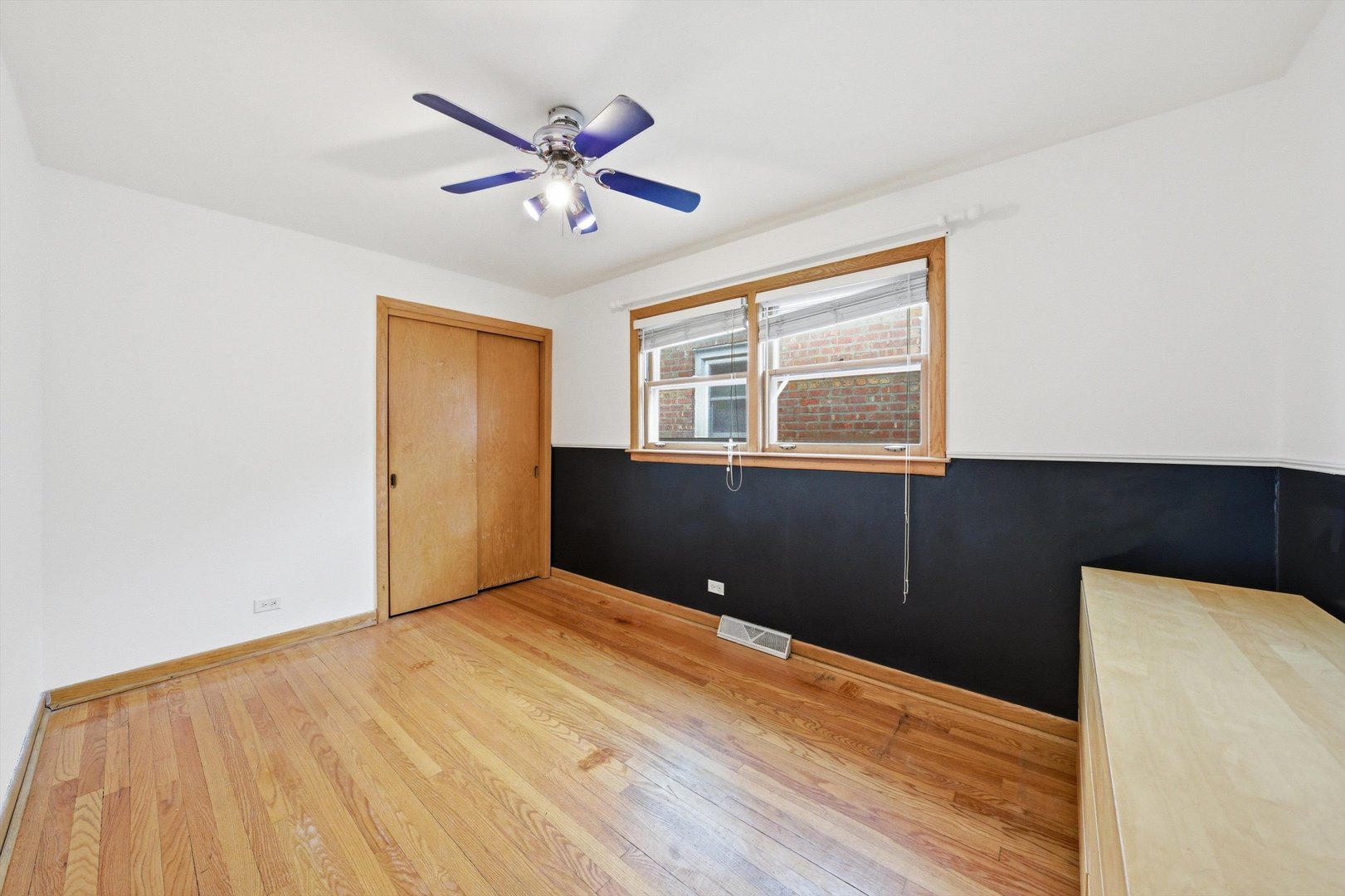 3701 West 80th Street Chicago, IL 60652 - Photo 18 of 34 a view of a livingroom with a ceiling fan and wooden floor