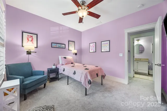a bathroom with a sink toilet and a mirror