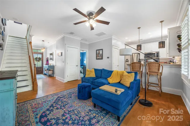 a kitchen with stainless steel appliances granite countertop a refrigerator sink and stove