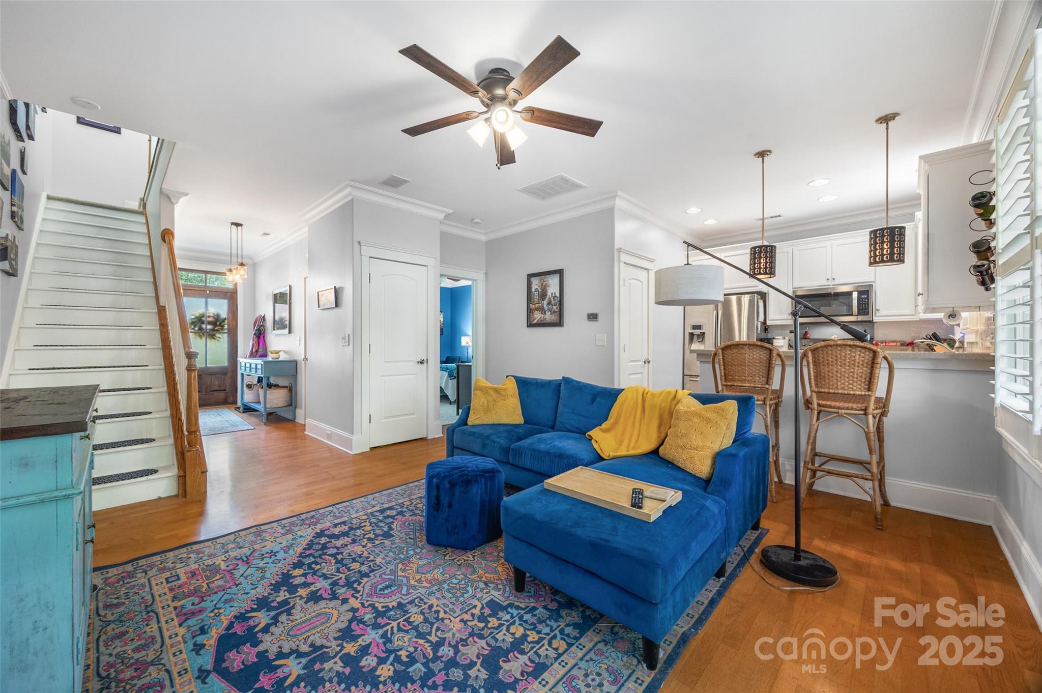 321 Landers Way Belmont, NC 28012 - Photo 7 of 26 a living room with furniture a rug and white walls