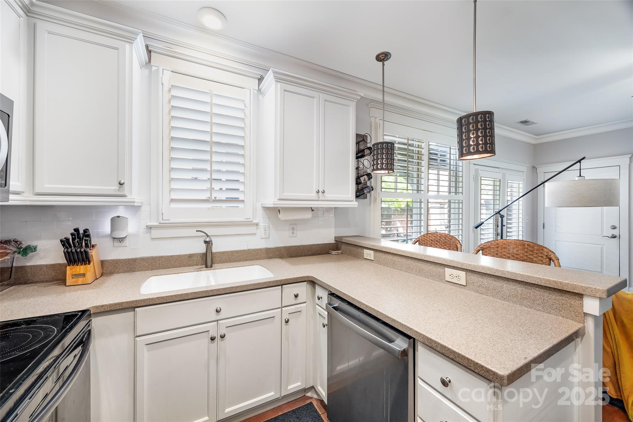 321 Landers Way Belmont, NC 28012 - Photo 9 of 26 a kitchen with stainless steel appliances a sink a window and cabinets