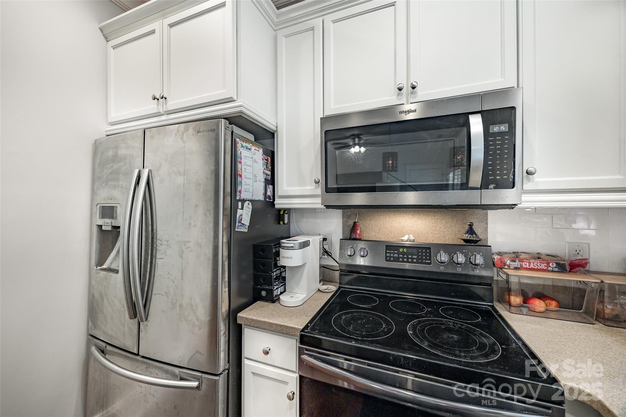 321 Landers Way Belmont, NC 28012 - Photo 10 of 26 a kitchen with stainless steel appliances granite countertop a stove a refrigerator and a microwave