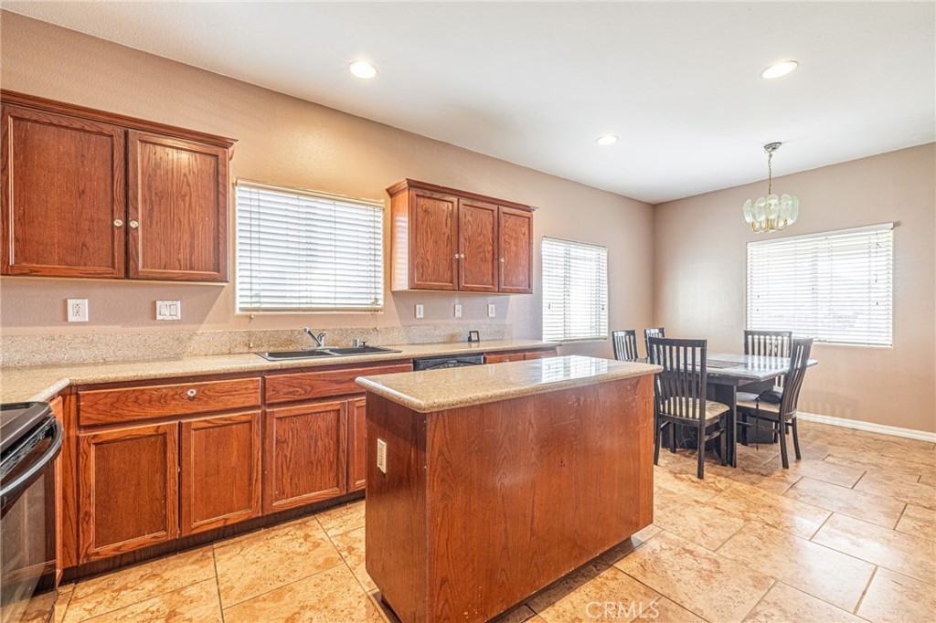 21419-21419 Neuralia Road California City, CA 93505 - Photo 16 of 35 a kitchen with a sink cabinets and window