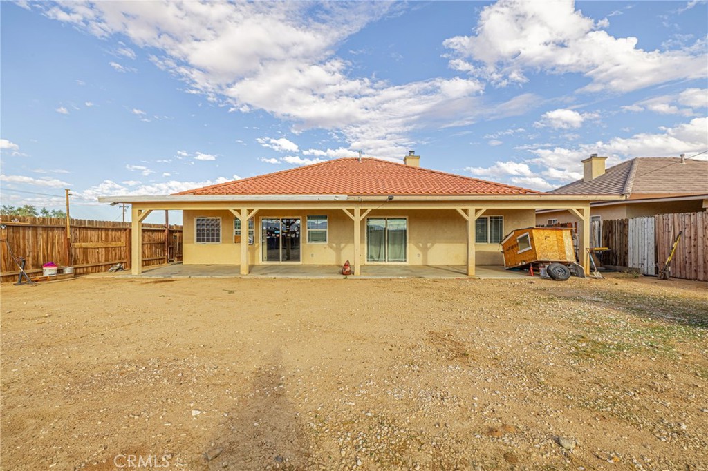 21419-21419 Neuralia Road California City, CA 93505 - Photo 34 of 35 a front view of a house with a garden