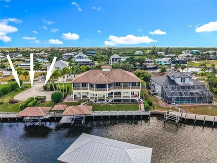 a view of a swimming pool with outdoor seating