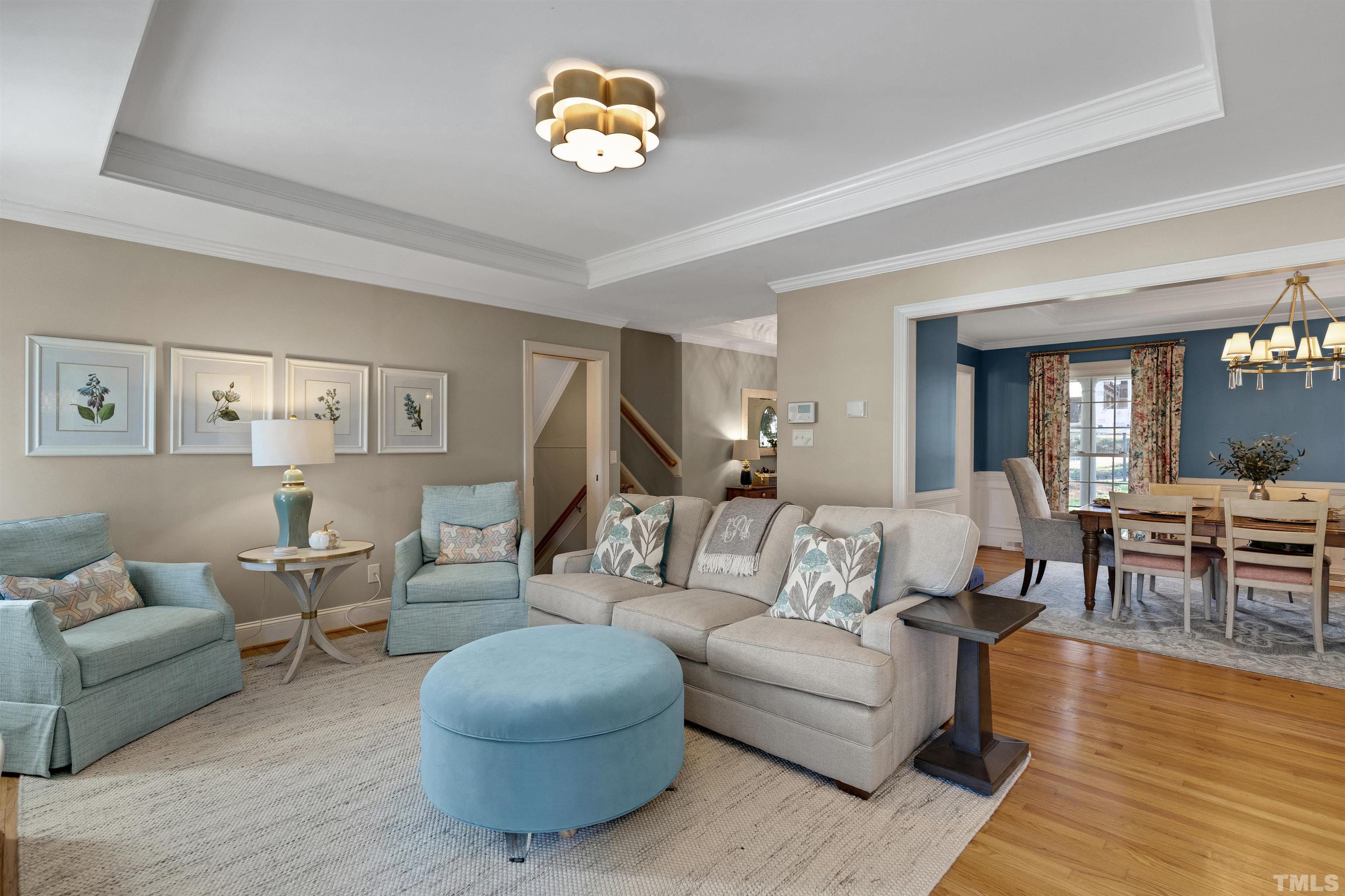 6813 Foxfire Place Raleigh, NC 27615 - Photo 11 of 38 a living room with furniture and a wooden floor