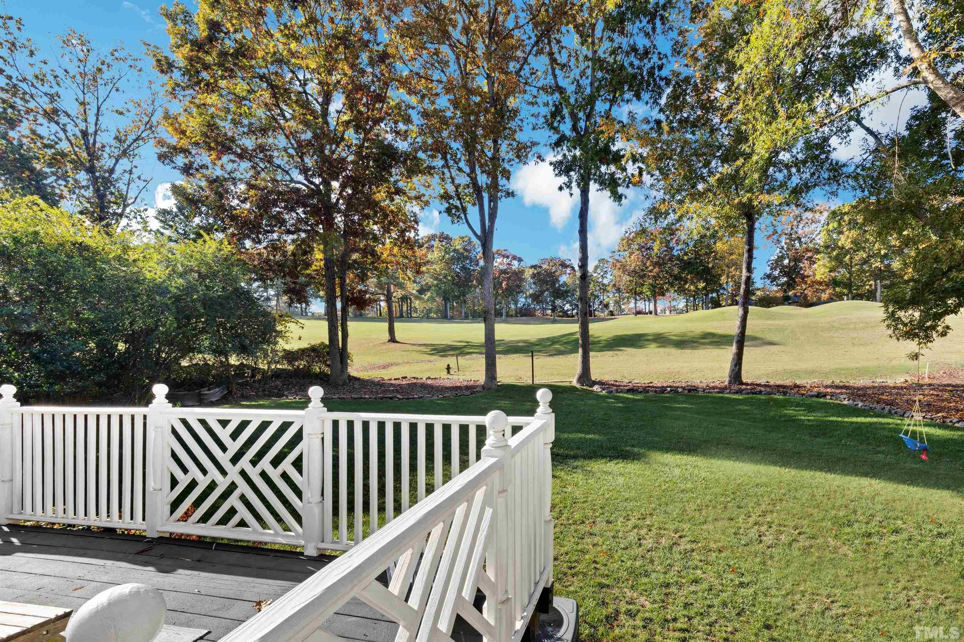 6813 Foxfire Place Raleigh, NC 27615 - Photo 38 of 38 a view of a deck with large trees and wooden fence