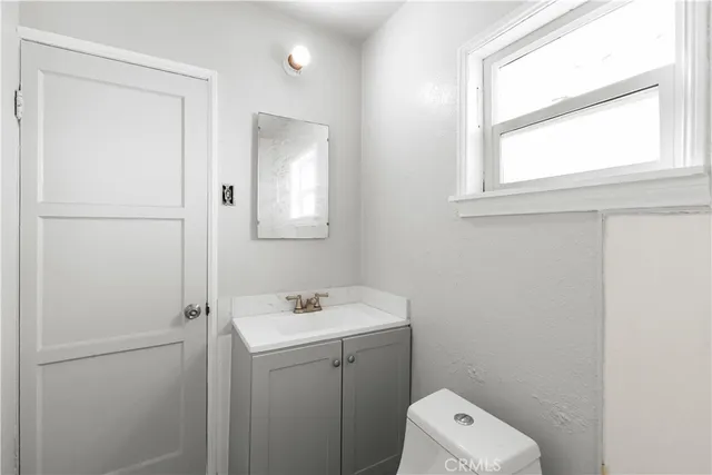 a white bath tub sitting next to a white toilet