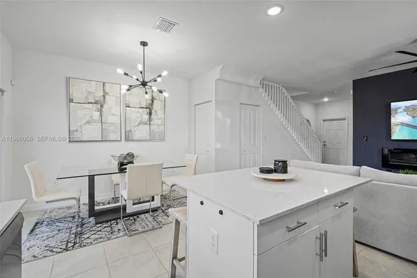 a dining room with furniture and window