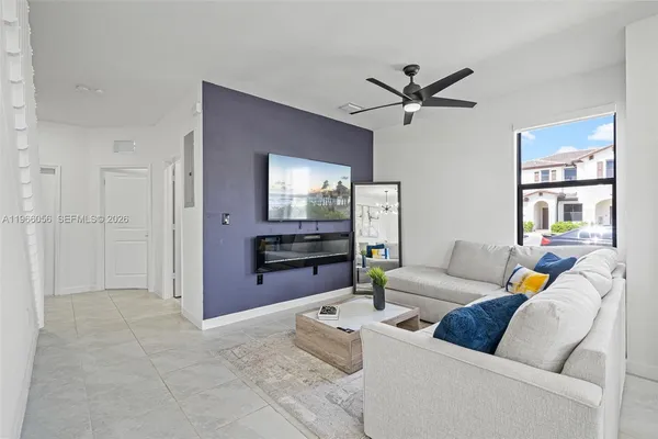 a living room with furniture and a fireplace