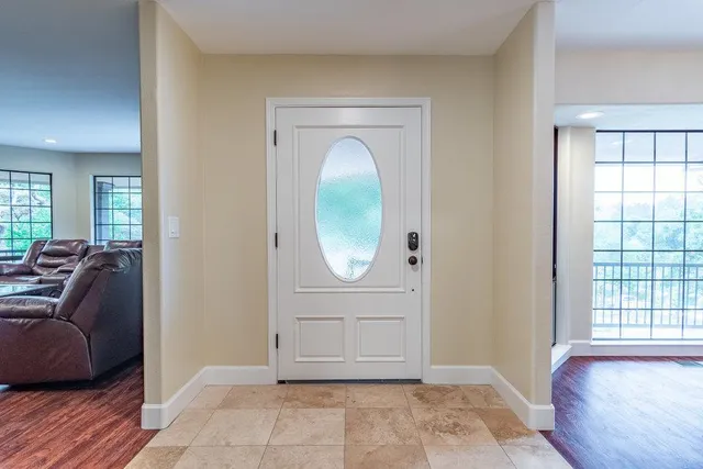 a kitchen with center island table and chairs