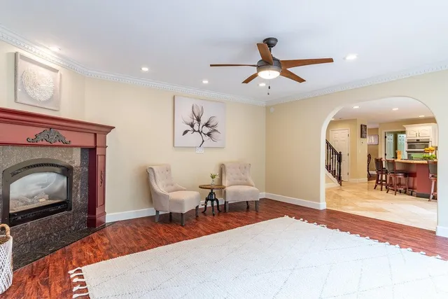 a bathroom with a granite countertop sink and a window