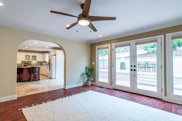 a living room with fireplace furniture and a wooden floor
