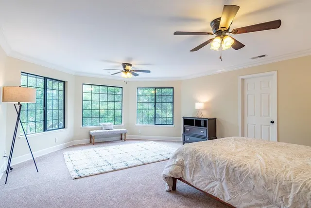 a view of an empty room with a ceiling fan