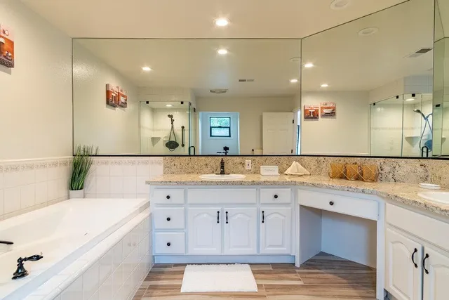a view of a patio with a table and chairs