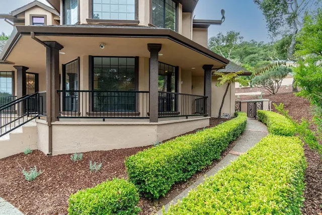 a view of a dining room with furniture a chandelier and wooden floor