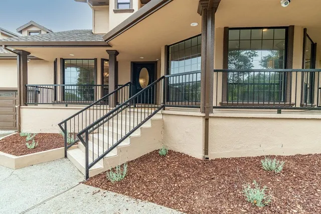 a dining room with furniture and chandelier