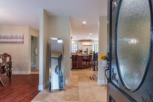 a view of a dining room with furniture wooden floor and chandelier