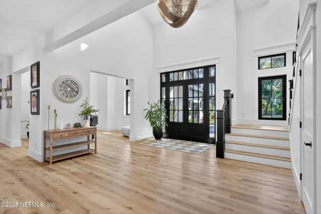 a living room with furniture a window and a dining table