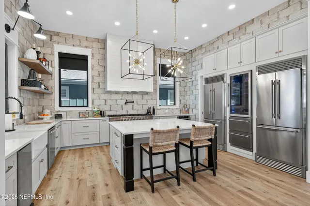 a bedroom with a bed and a flat tv screen on wall