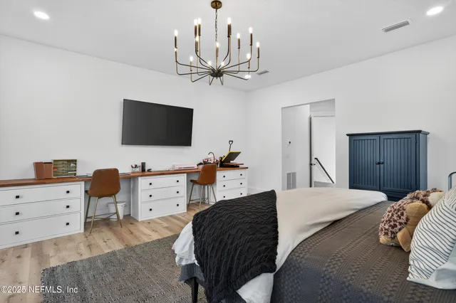 an aerial view of house with yard and mountain view in back