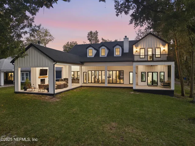 a front view of a house with a yard table and chairs