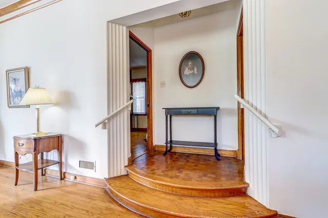an empty room with wooden floor and closet