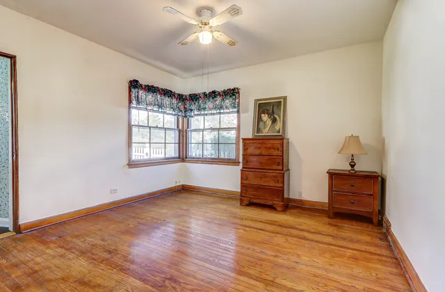 a bathroom with a granite countertop toilet a sink and a shower